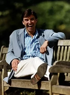 Images Dated 26th September 1990: Adrian Mills TV Presenter / Actor Sitting on park bench Dbase A©Mirrorpix
