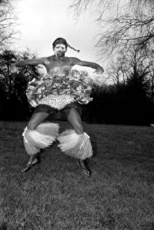 African Dancing: Ghanan Dancers. One of the dancers complete with war paint seen African Dancing: Ghanan Dancers. One of the dancers complete with war paint seen