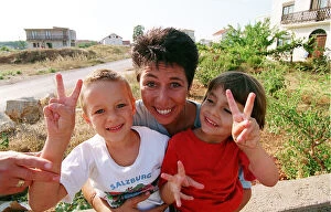 Images Dated 1st August 1993: Aid worker Sally Becker pictured in Bosnia with children during war in Yugoslavia