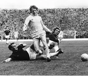 Images Dated 14th September 1974: Alan Clarke of Leeds United beats two Burnley defenders Billy Rodaway (left