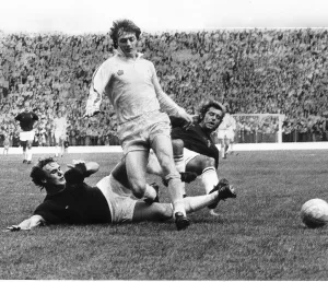 Alan Clarke of Leeds United beats two Burnley defenders Billy Rodaway (left Alan Clarke of Leeds United beats two Burnley defenders Billy Rodaway (left
