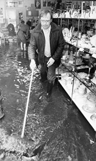 Images Dated 22nd June 1983: Alan Finney owner of the K Centre shop in Linthorpe seen here helping to bail out water