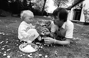 Alex Higgins World Snooker Champion 1982 playing in the garden with his daughter Alex Higgins World Snooker Champion 1982 playing in the garden with his daughter