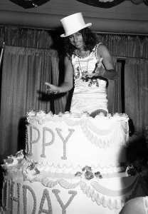 Alice Cooper American rock singer jumps out of a birthday cake 1975 Alice Cooper American rock singer jumps out of a birthday cake 1975