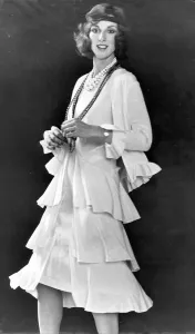 All that jazz ... Cream sleeveless dress de chine has triple flared skirt All that jazz ... Cream sleeveless dress de chine has triple flared skirt