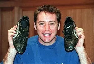 Images Dated 1st November 1988: Ally McCoist actions football boots for Cash For Kids. Charity November