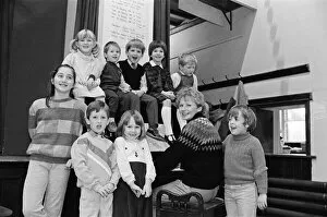 Images Dated 19th December 1985: Almondbury Methodist Junior Church Christmas Party, singing carols round the piano
