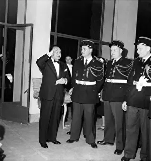 American Actor Edward G Robinson seen here saluting French Policeman. D3118-022 American Actor Edward G Robinson seen here saluting French Policeman. D3118-022