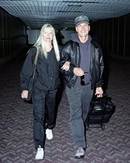 Images Dated 18th September 1992: American actor Patrick Swayze with his wife Lisa on arrival at Heathrow Airport