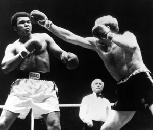 American Heavyweight Champion of the World Muhammad Ali in action against Richard Dunn of American Heavyweight Champion of the World Muhammad Ali in action against Richard Dunn of
