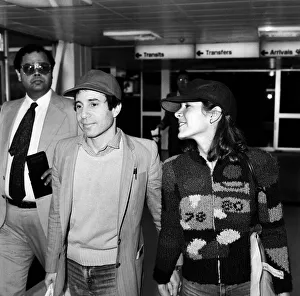 American musician Paul Simon and actress Carrie Fisher at Heathrow airport. 24th May 1980 American musician Paul Simon and actress Carrie Fisher at Heathrow airport. 24th May 1980