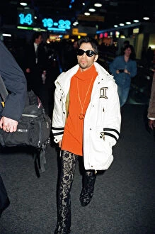 Images Dated 19th June 1997: American pop star, the artist formerly known as Prince, leaving Heathrow Airport for New