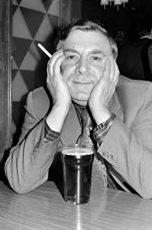 Images Dated 15th April 1975: Andy Bradley enjoying his pint and a fag in the local before the chancellor puts up