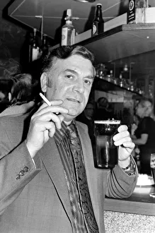 Images Dated 15th April 1975: Andy Bradley enjoying his pint and a fag in the local before the chancellor puts up