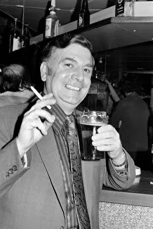 Images Dated 15th April 1975: Andy Bradley enjoying his pint and a fag in the local before the chancellor puts up