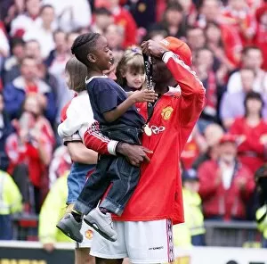 Images Dated 16th May 1999: Andy Cole Football player for Manchester United May 1999 showing his son Devante