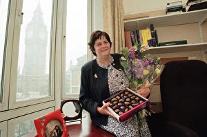 Images Dated 20th May 1997: Ann Widdecombe in her Perliament office holding flowers and a box of chocolates