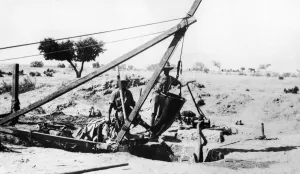 ANZAC Engineers using special leather bucket for raising water from deep wells ANZAC Engineers using special leather bucket for raising water from deep wells