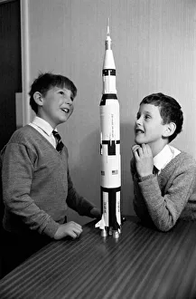 Apollo 12 moon rocket model on display. L to R, Paul Ward Apollo 12 moon rocket model on display. L to R, Paul Ward