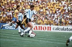 Images Dated 2nd July 1982: Argentina v Brazil 1982 World Cup match Calderon tackled by Luisinho