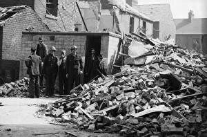 ARP personnel, Air raid warden help to search for survivors in an East Hull street after ARP personnel, Air raid warden help to search for survivors in an East Hull street after