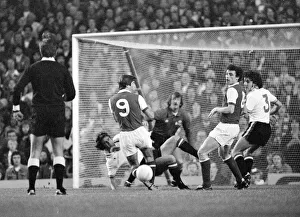 Arsenal's attack is led by Malcolm McDonald against the Manchester United goal Arsenal's attack is led by Malcolm McDonald against the Manchester United goal
