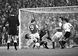 Images Dated 30th August 1977: Arsenals attack is led by Malcolm McDonald against the Manchester United goal