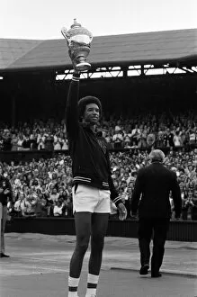 Images Dated 5th July 1975: Arthur Ashe with the Wimbledon trophy after he beat the defending champion Jimmy Connors