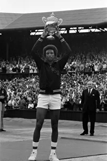 Images Dated 5th July 1975: Arthur Ashe with the Wimbledon trophy after he beat the defending champion Jimmy Connors