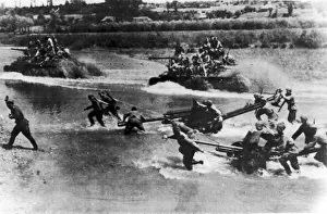 Artillery and tanks of the Russian Red Army force a river crossing in the Soviet advance Artillery and tanks of the Russian Red Army force a river crossing in the Soviet advance