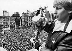 Fans Collection: Aston Villa footballer Gary Shaw shows of the the league Championship trophy to