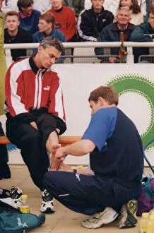 Images Dated 19th June 1999: Athlete Jonathan Edwards Jonathan Edwards has his ankle strapped by a doctor
