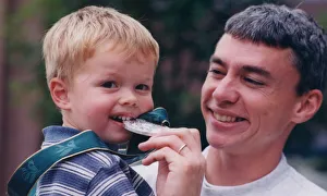 Athlete Jonathan Edwards Jonathan Edwards with his son Sam whio takes a bit Athlete Jonathan Edwards Jonathan Edwards with his son Sam whio takes a bit