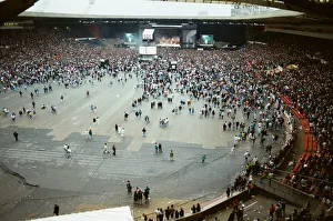 Audience gathered around the stage at Wembley where Michael Jackson can be seen Audience gathered around the stage at Wembley where Michael Jackson can be seen