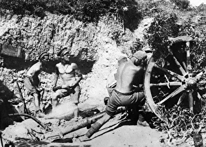 Australian gunners of the 9th Field Battery stripped to the waist operating the Number 4 Australian gunners of the 9th Field Battery stripped to the waist operating the Number 4