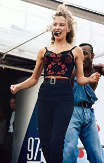 Images Dated 7th August 1992: Australian pop singer Kylie Minogue performing on stage at the BBC Radio One Roadshow