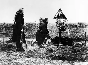 Austrian Officer pay tribute to a fallen officers grave Austrian Officer pay tribute to a fallen officers grave