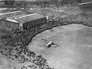 An Avro 504K three seater bi plane draws a huge crowds as it makes a landing at Alexandra An Avro 504K three seater bi plane draws a huge crowds as it makes a landing at Alexandra