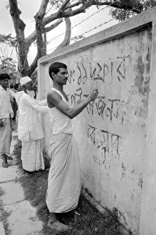 Bangladesh signs being chipped off walls, by order of the Military Government in Dacca Bangladesh signs being chipped off walls, by order of the Military Government in Dacca