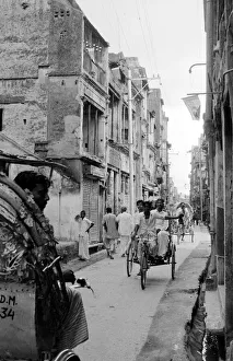 Nm20060726 Gallery: Bangladesh - Street Scene Tikka Khan Street with Pakistan flags hanging from