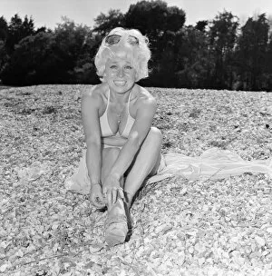 Images Dated 7th July 1976: Barbara Windsor, Actress, 7th July 1976. Pictured, taking a break from an unusual role