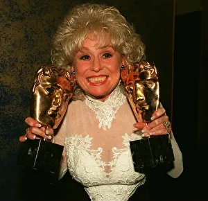 Barbara Windsor holding Bafta awards after Eastenders had won best Drama series Barbara Windsor holding Bafta awards after Eastenders had won best Drama series
