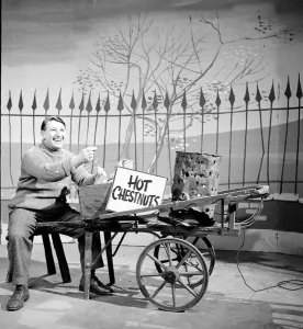 Televison Gallery: BBC broadcaster and presenter Johnny Morris as the Hot Chestnut man during the filming of