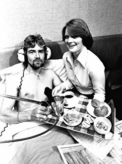 Images Dated 1st October 1977: BBC Radio One DJ Noel Edmonds doing his breakfast radio show from his bed at the Centre