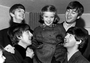 The Beatles with Anne Escreet aged 9 who was specially invited to meet them at their The Beatles with Anne Escreet aged 9 who was specially invited to meet them at their