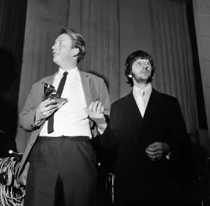 Beatles drummer Ringo Starr presents a Grammy Award to 22 year old EMI recording engineer Beatles drummer Ringo Starr presents a Grammy Award to 22 year old EMI recording engineer