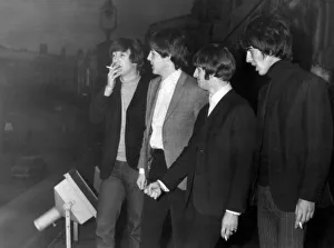 The Beatles enjoy a cigarette break on the balcony of the Empire Theatre in Liverpool 8th The Beatles enjoy a cigarette break on the balcony of the Empire Theatre in Liverpool 8th