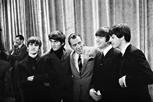 Presenters Gallery: The Beatles with television host Ed Sullivan during their visit to the USA February 1964