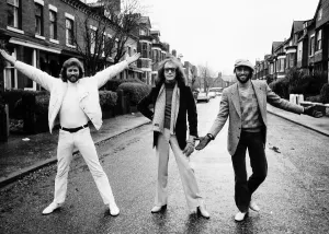 The Bee Gees pop group 1981 Barry Gibb Maurice Gibb Robin Gibb standing in street The Bee Gees pop group 1981 Barry Gibb Maurice Gibb Robin Gibb standing in street