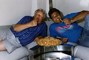 Images Dated 13th October 1992: Benny Hill Actor Comedian With Fellow Actor Erik Estrada Eating A Plate Of Chips